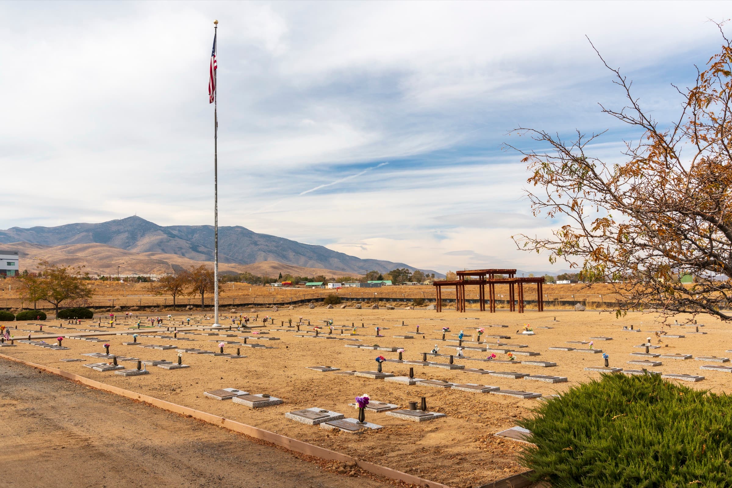 The grounds with the American flag and the mountains beyond
